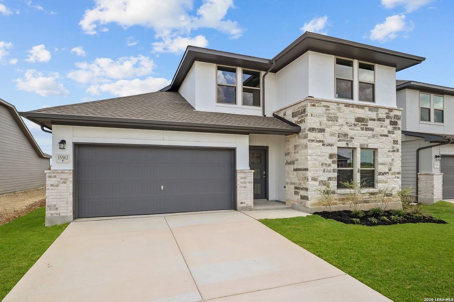 Front exterior of a new home in Summerlin, San Antonio, TX, highlighting curb appeal (Image 24). Front exterior of a new home in Summerlin, San Antonio, TX, highlighting curb appeal (Image 24).