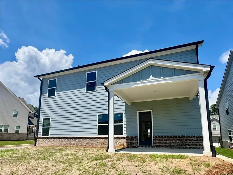 Exterior details and patio area of a home in Eastlyn Crossing, Flowery Branch (Image 4).