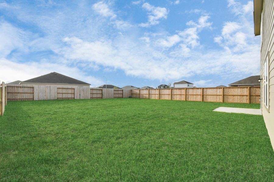 Exterior details and patio area of a home in Sunterra, Katy (Image 24).