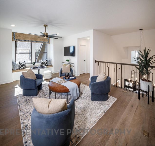 Living room featuring ceiling fan, wood finished floors, and recessed lighting