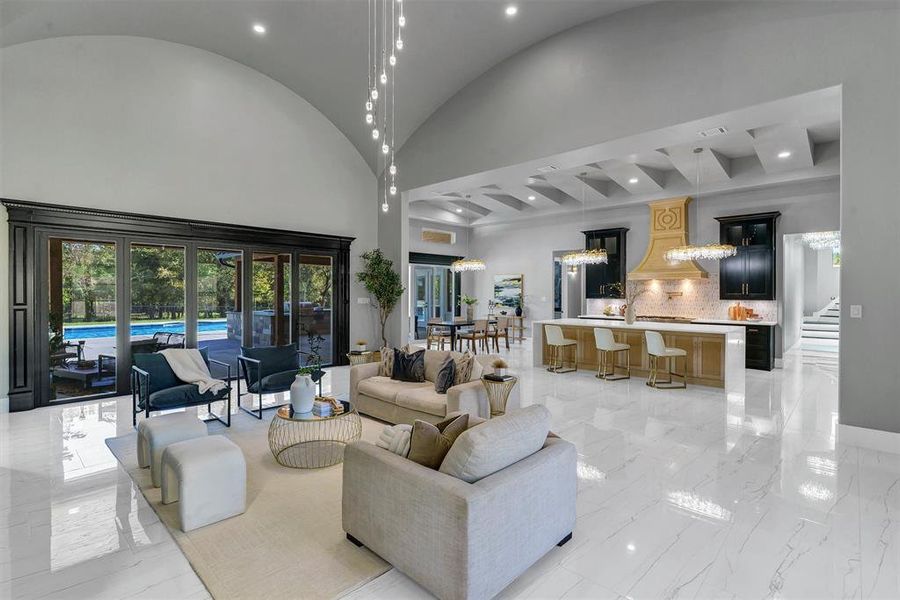 Living room featuring a high ceiling and french doors