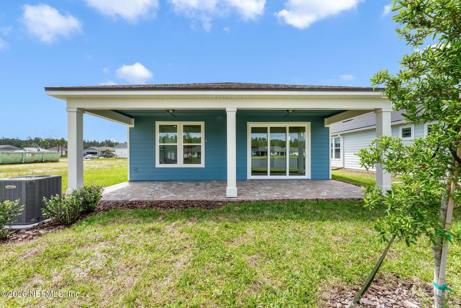 Exterior details and patio area of a home in Del Webb Wildlight, Wildlight (Image 25).