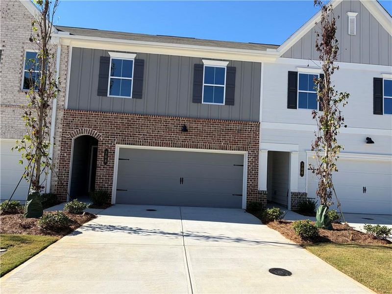 Front exterior of a new home in Cherokee Township, Acworth, GA, highlighting curb appeal (Image 1). Front exterior of a new home in Cherokee Township, Acworth, GA, highlighting curb appeal (Image 1).