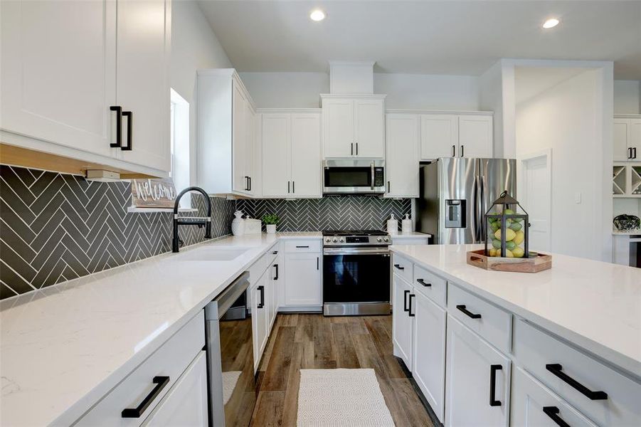 Quartz countertops and a large island space perfect for entertaining!