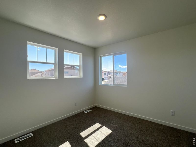 Spacious, unfurnished interior of a new home in Union Colony West, Greeley (Image 14).