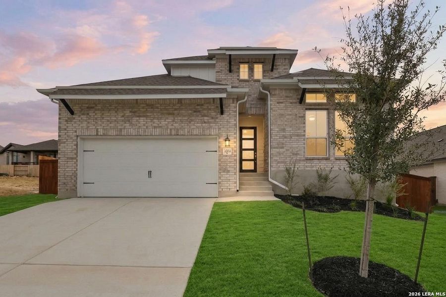 Front exterior of a new home in Homestead, Schertz, TX, highlighting curb appeal (Image 24).