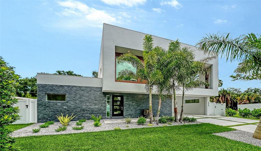 Front exterior of a new home in , Sarasota, FL, highlighting curb appeal (Image 24).