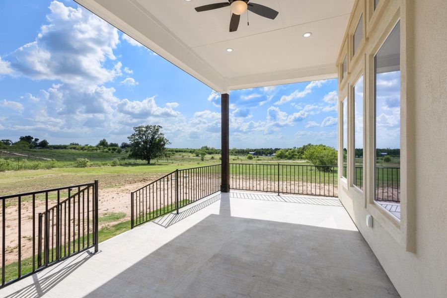 View of patio featuring a view of rural / pastoral area and a ceiling fan View of patio featuring a view of rural / pastoral area and a ceiling fan