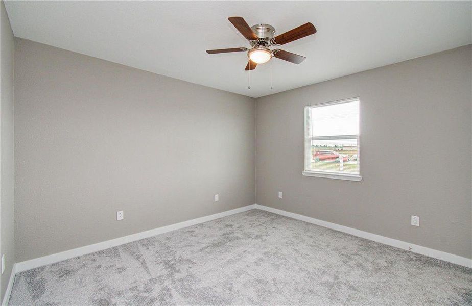 Primary Bedroom. Updated carpet, light fixtures and private closet with ample lighting.