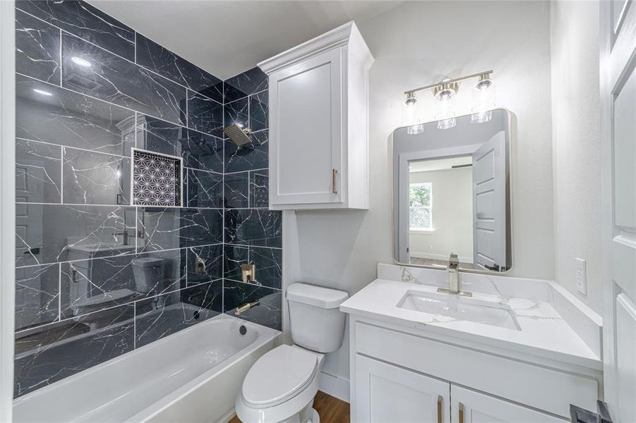 Bathroom featuring bathtub / shower combination and vanity Bathroom featuring bathtub / shower combination and vanity