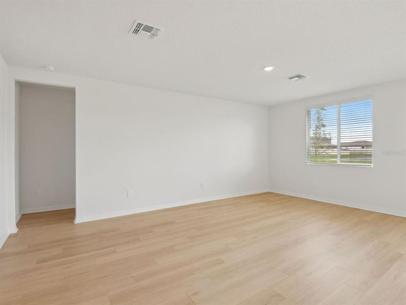 Spacious, unfurnished interior of a new home in The Grove at Stuart Crossing - Classic Series, Bartow (Image 13).