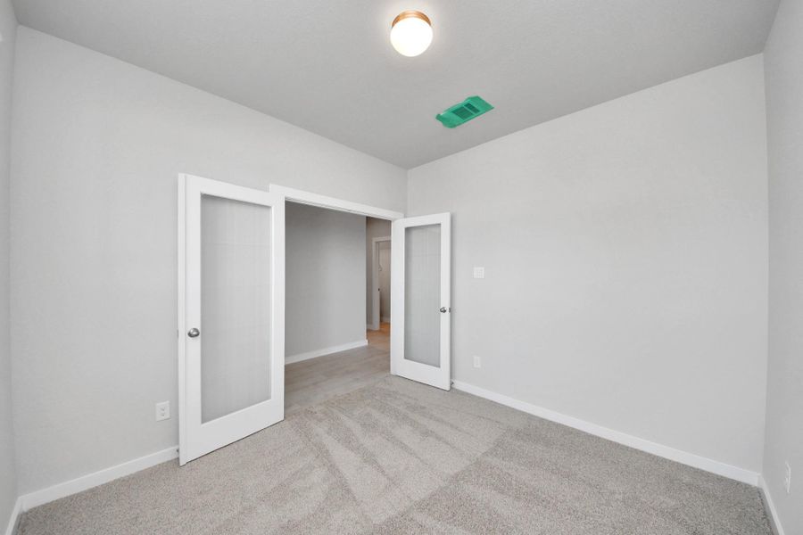 An aerial view of a spacious subdivision lot, highlighting a well-maintained yard and a fully fenced perimeter, offering both privacy and expansive outdoor space. Sample photo of completed home with similar floor plan. Actual colors and selections may vary. An aerial view of a spacious subdivision lot, highlighting a well-maintained yard and a fully fenced perimeter, offering both privacy and expansive outdoor space. Sample photo of completed home with similar floor plan. Actual colors and selections may vary.