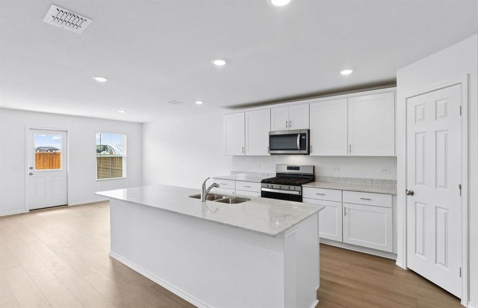 Kitchen featuring a large island ideal for informal dining and gatherings Kitchen featuring a large island ideal for informal dining and gatherings