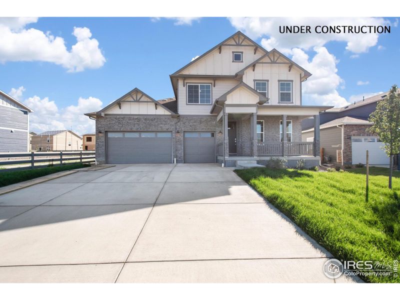 Front exterior of a new home in Vantage, Berthoud, CO, highlighting curb appeal (Image 2).