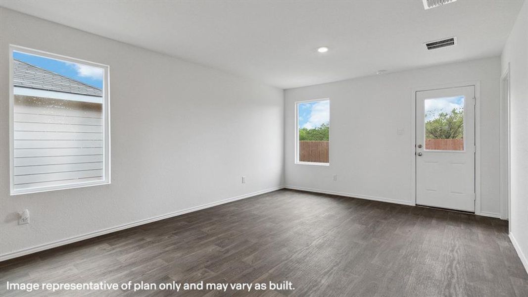 Spare room with dark wood-style floors and recessed lighting
