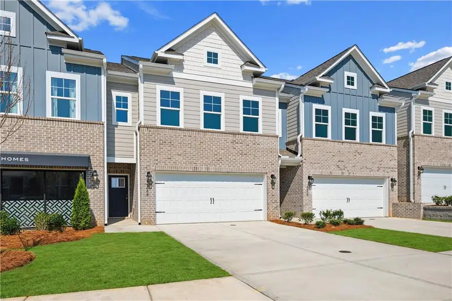 Front exterior of a new home in Langley Overlook, Loganville, GA, highlighting curb appeal (Image 15).