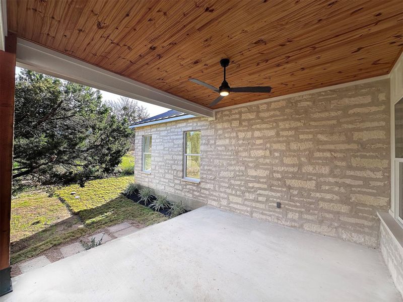 View of patio / terrace featuring ceiling fan and solid tongue & groove wood ceiling.  Perfect to add a gas range and seating for comfortable outdoor entertaining