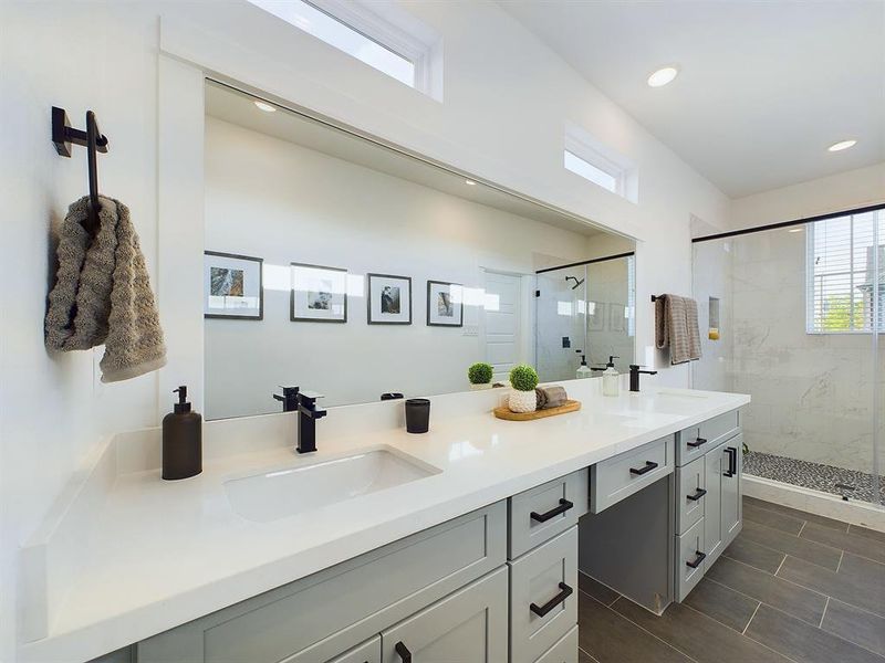 Beautiful primary bathroom with Quartz double sink vanity top and soft close drawers and doors. Photos from another development by Disama Group. FINISHES & COLORS MAY VARY