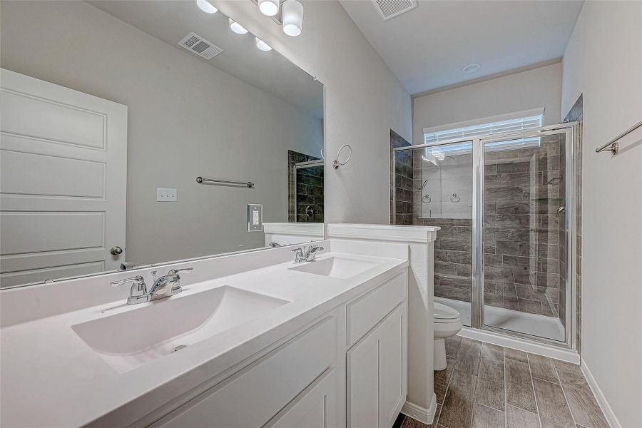Furnished interior view inside a new home in Mill Creek Trails, Magnolia (Image 14).