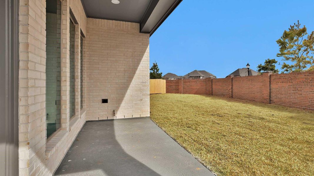 Exterior details and patio area of a home in Marvida, Cypress (Image 3).