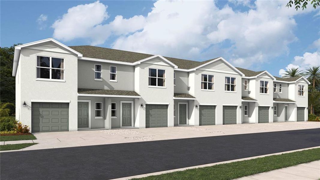 Front exterior of a new home in Townes at Island Lake, Pinellas Park, FL, highlighting curb appeal (Image 2).