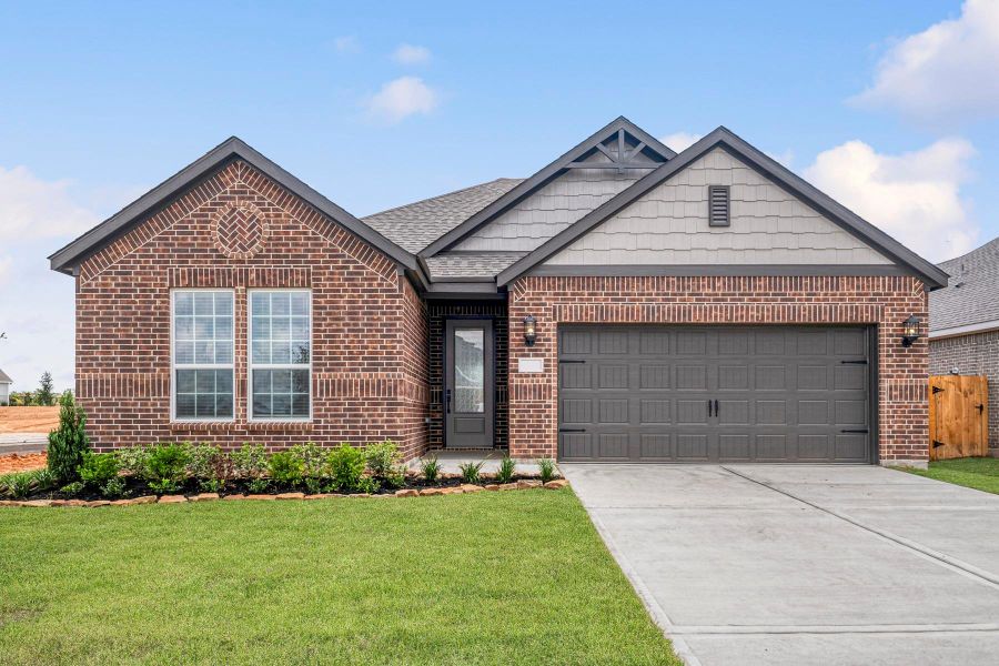 Front exterior of a new home in Sweetwater Ridge, Conroe, TX, highlighting curb appeal (Image 1). Front exterior of a new home in Sweetwater Ridge, Conroe, TX, highlighting curb appeal (Image 1).
