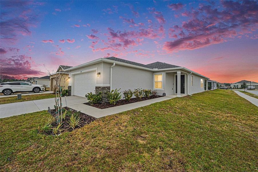 Front exterior of a new home in , Haines City, FL, highlighting curb appeal (Image 1). Front exterior of a new home in , Haines City, FL, highlighting curb appeal (Image 1).