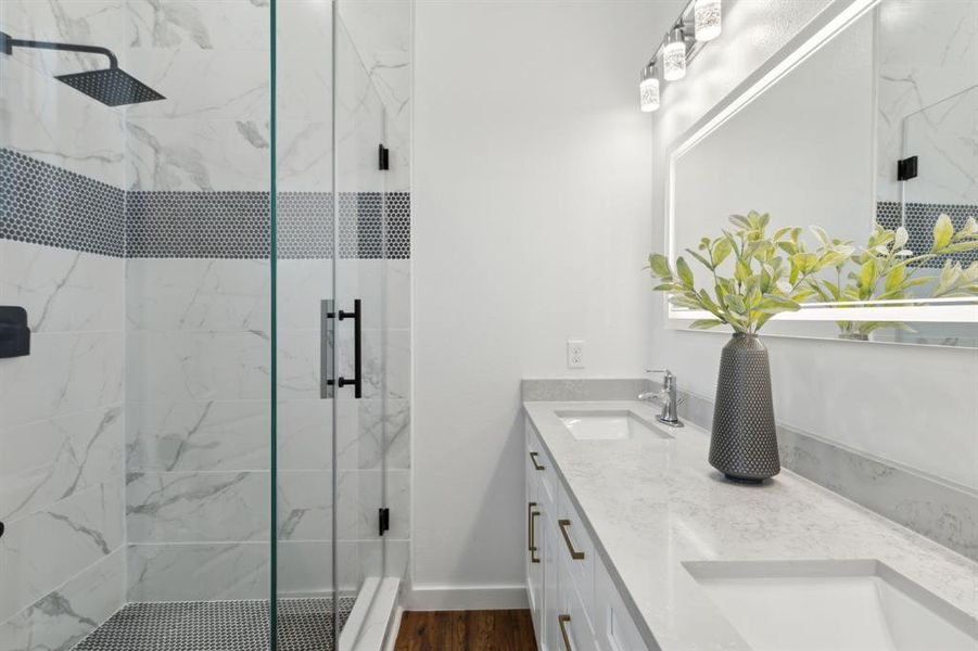 Another view of the primary bathroom with an oversized shower with frameless glass Another view of the primary bathroom with an oversized shower with frameless glass