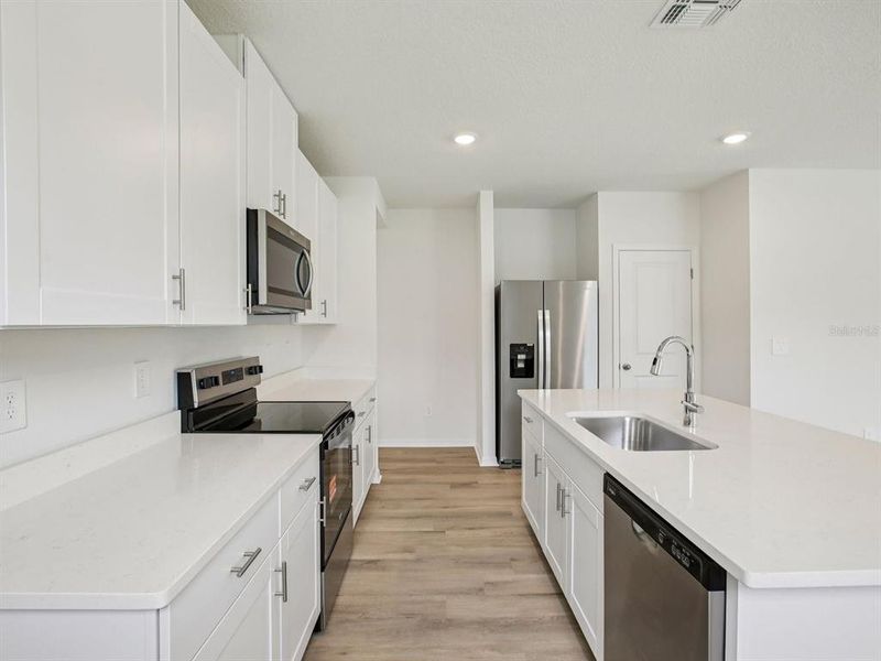 Furnished interior view inside a new home in The Grove at Stuart Crossing - Premier Series, Bartow (Image 6).