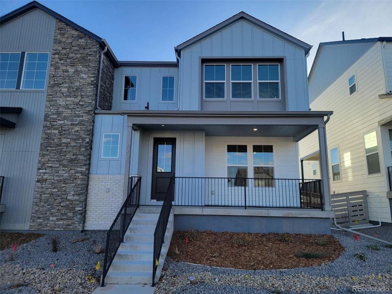 Front exterior of a new home in , Littleton, CO, highlighting curb appeal (Image 1).