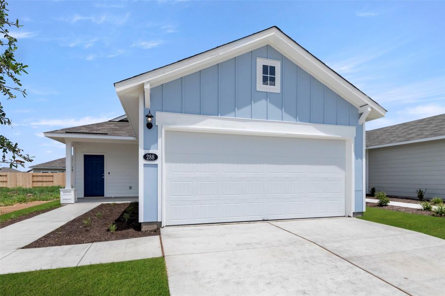 View of front of property with a shingled roof, board and batten siding, driveway, and an attached garage View of front of property with a shingled roof, board and batten siding, driveway, and an attached garage