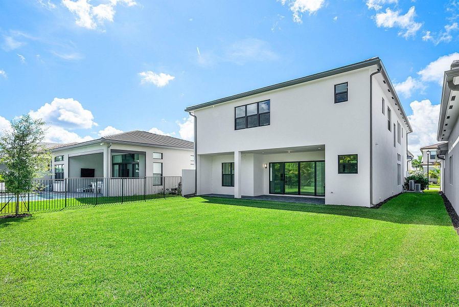 Front exterior of a new home in Lotus Edge, Boca Raton, FL, highlighting curb appeal (Image 44).