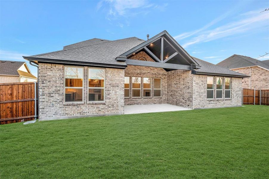 Exterior details and patio area of a home in Kreymer at the Park, Wylie (Image 3).