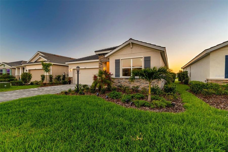 Front exterior of a new home in Star Farms at Lakewood Ranch, Bradenton, FL, highlighting curb appeal (Image 27).