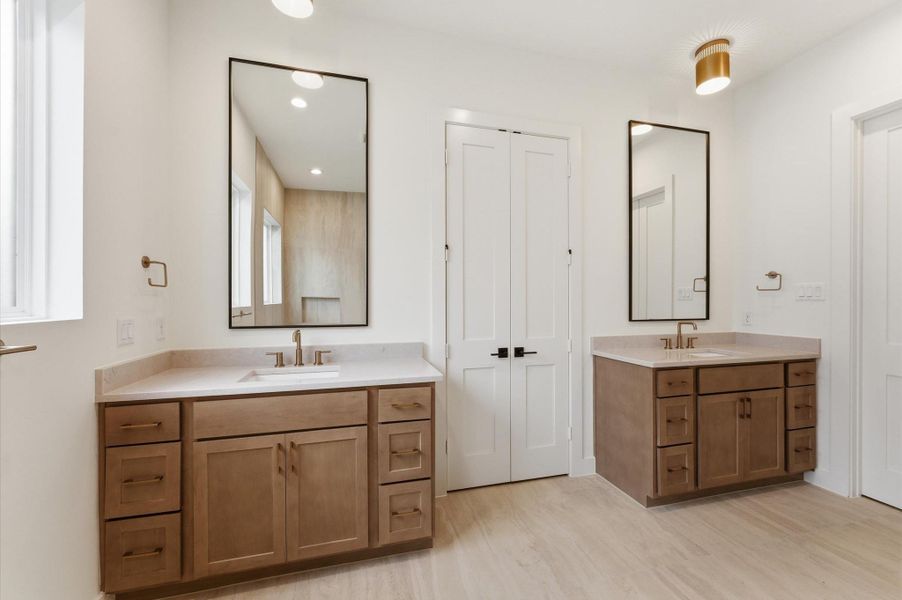 Primary bath with dual vanities.