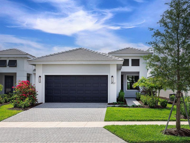 Front exterior of a new home in , Bradenton, FL, highlighting curb appeal (Image 17).