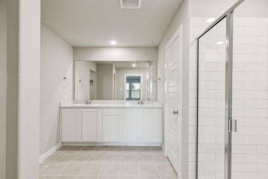 Primary Bathroom in the Harper home plan by Trophy Signature Homes – REPRESENTATIVE PHOTO Primary Bathroom in the Harper home plan by Trophy Signature Homes – REPRESENTATIVE PHOTO