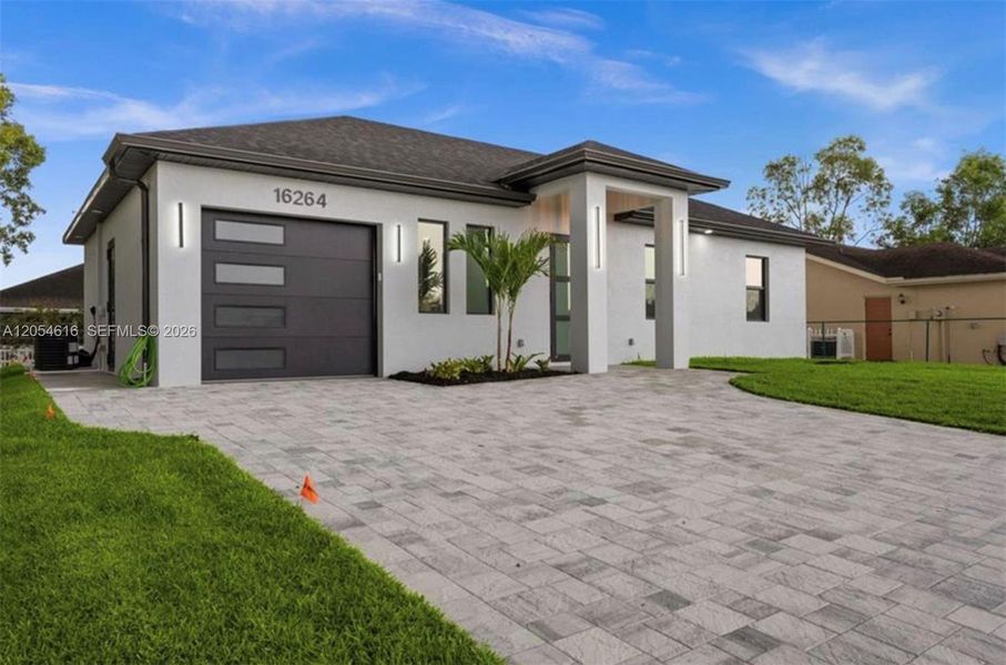 Front exterior of a new home in , North Fort Myers, FL, highlighting curb appeal (Image 21). Front exterior of a new home in , North Fort Myers, FL, highlighting curb appeal (Image 21).