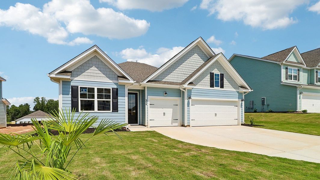 Front exterior of a new home in Shell Pointe, Gilbert, SC, highlighting curb appeal (Image 18).