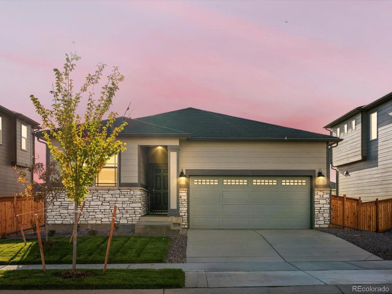 Front exterior of a new home in Buffalo Highlands: The Flora Collection, Commerce City, CO, highlighting curb appeal (Image 14).
