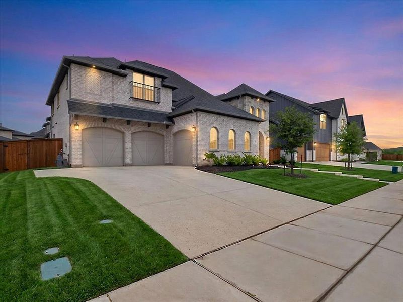 Front exterior of a new home in Light Farms Graham/Reagan, Celina, TX, highlighting curb appeal (Image 2). Front exterior of a new home in Light Farms Graham/Reagan, Celina, TX, highlighting curb appeal (Image 2).