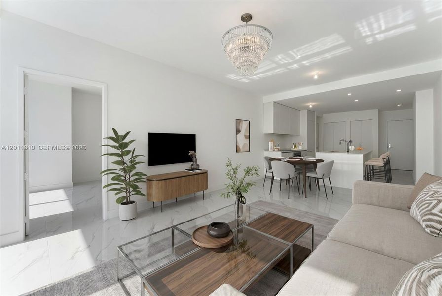 Spacious, sun-filled open-concept living area featuring floor-to-ceiling impact glass, high ceilings, and seamless flow to a deep waterfront balcony. Image is virtuallt staged.
