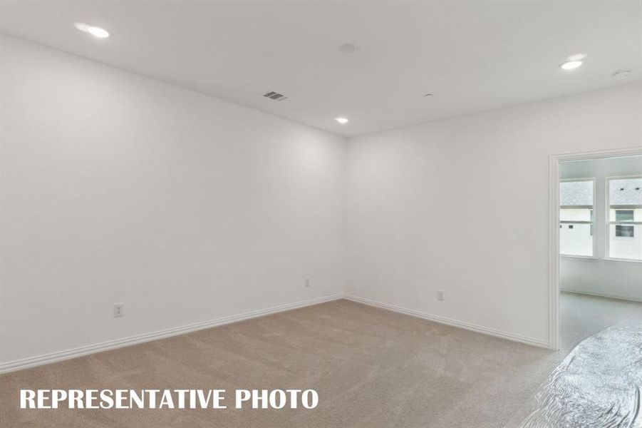 The upstairs game room offers the perfect place for a second family living area.  REPRESENTATIVE PHOTO