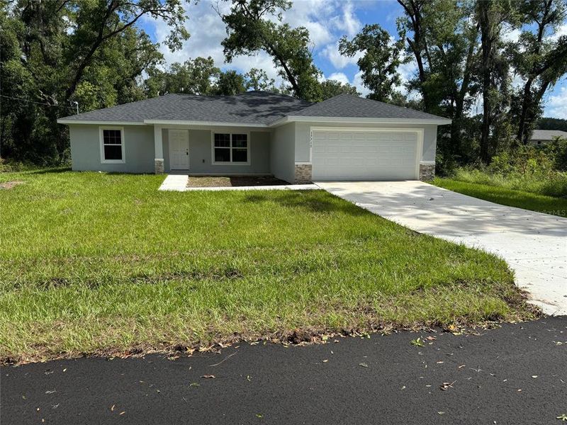 Front exterior of a new home in , Dunnellon, FL, highlighting curb appeal (Image 2). Front exterior of a new home in , Dunnellon, FL, highlighting curb appeal (Image 2).