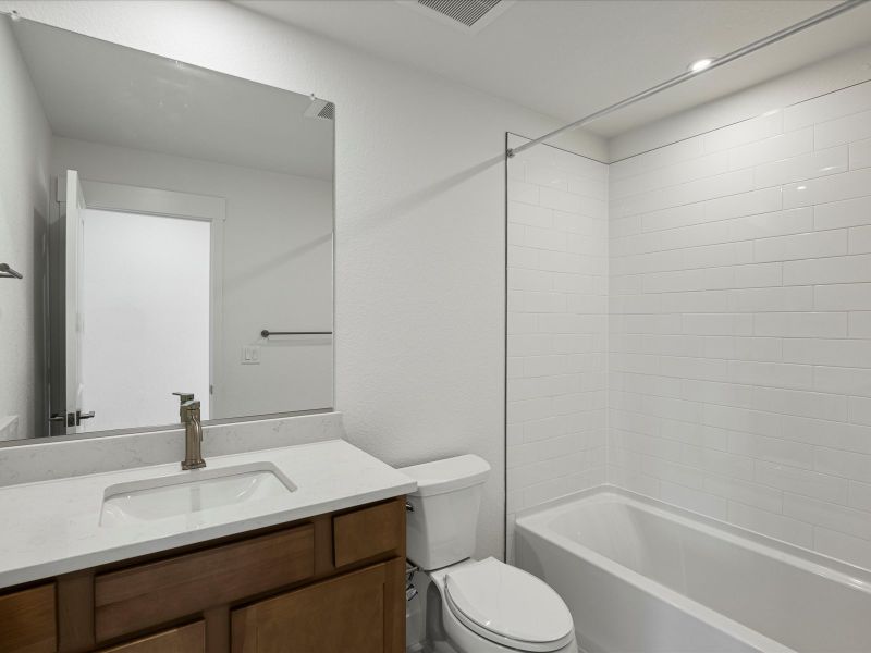 Furnished interior view inside a new home in Ascent at Inverness, Englewood (Image 12).