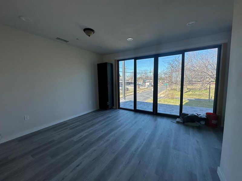 Spare room featuring hardwood / wood-style flooring (laminate)