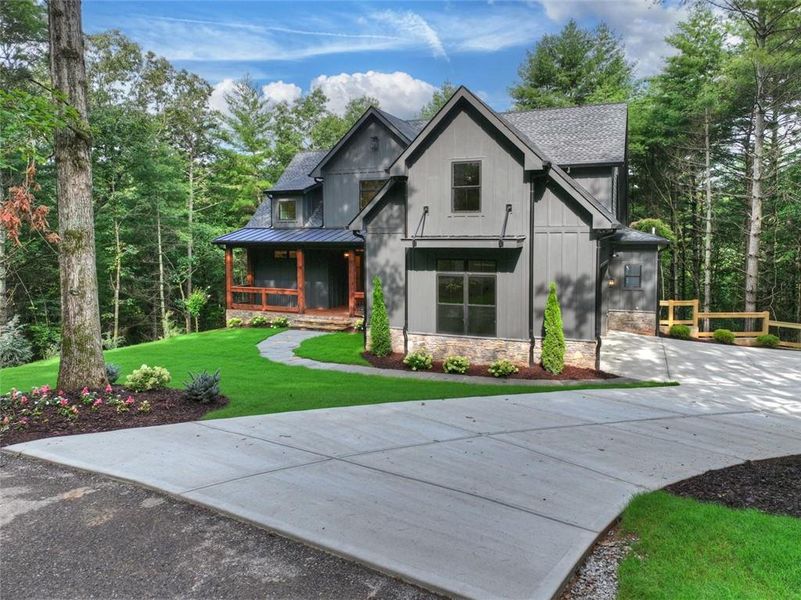 Front exterior of a new home in , Ellijay, GA, highlighting curb appeal (Image 1). Front exterior of a new home in , Ellijay, GA, highlighting curb appeal (Image 1).