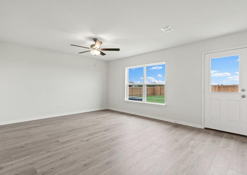 The family room of the Rio Grande has a large window with backyard views.