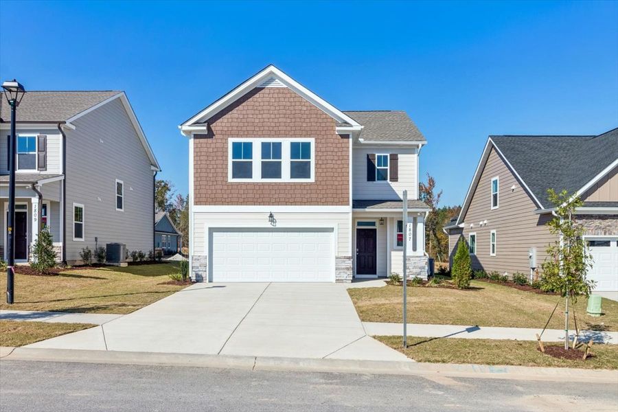 Front exterior of a new home in Tillery Park, Grovetown, GA, highlighting curb appeal (Image 1). Front exterior of a new home in Tillery Park, Grovetown, GA, highlighting curb appeal (Image 1).