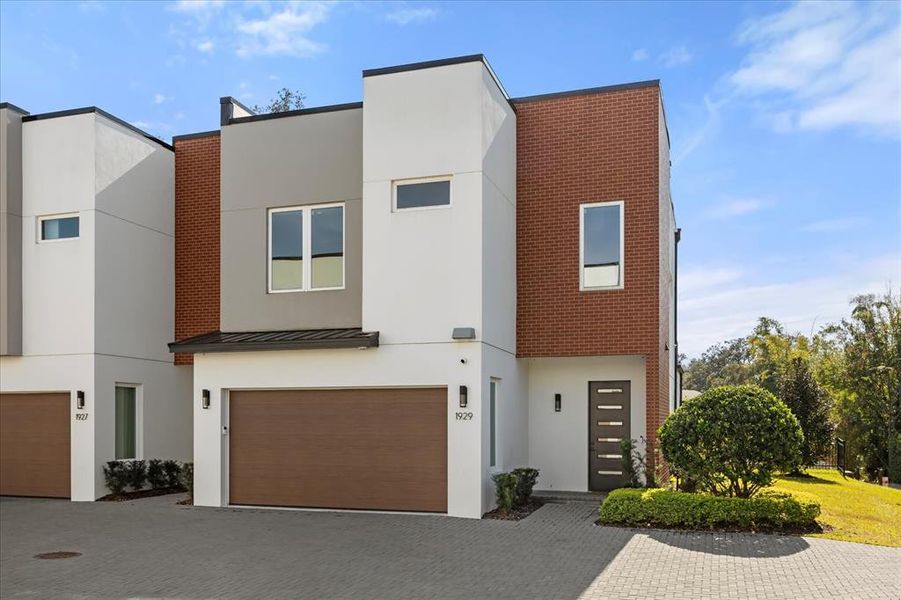 Front exterior of a new home in , Winter Park, FL, highlighting curb appeal (Image 1).